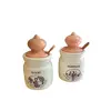 Foto de um(a) Potes em porcela - Ancers, da categoria de Cremeiras. ancers - par de potes em porcelana com tampas.acompanha espatulas em madeira.medidas: alt 18 cm x diam 10cm. Vendido no marketplace Trésors.