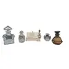 Foto de um(a) Coleção Raros Frascos De Perfumes Franceses, da categoria de Garrafas, potes e jarros. Belíssima coleção de frascos de perfumes franceses (vazios). Sendo 4 de vidro transparente e 1 de cristal âmbar. Marca... Vendido no marketplace Trésors.