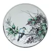 Foto de um(a) Prato ornamental estilo sumi-e, da categoria de Pratos Decorativos. Prato ornamental em porcelana branca, com pintura feita à mão em policromia de estilo asiático. Apresenta pássaro em um... Vendido no marketplace Trésors.