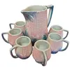 Foto de um(a) Conjunto de Jarra e Canecas Espiga de Milho, da categoria de Conjuntos de servir. Magnífico conjunto de refresco vintage em cerâmica figurativa, apresentando um design detalhado em relevo de espiga de milho... Vendido no marketplace Trésors.
