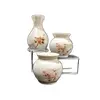 Foto de um(a) Combo Três Vasinhos em Porcelana, Década de 1980, da categoria de Vasos. Combo com três vasos em porcelana policromada com motivo floral. A: 7,4 cm e 5,3 cm Diâmetro: 4,7 cm e 5,4 cm Peso total:... Vendido no marketplace Trésors.