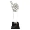 Foto de um(a) Troféu Joinha Cristal, da categoria de Escultura. Escultura em cristal do joinha, base um prisma de quatro faces em cristal preto.A: 21cm Base: 6.5 x 7 x 4.5 cm Peso: 718g. Vendido no marketplace Trésors.