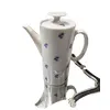 Foto de um(a) Bule de Café Miosótis Anos 70, da categoria de Bules. Bule de café em porcelana branca com miosótis azul cobalto, década de 1970, sem marca do fabricante. A: 23 cm C da asa ao... Vendido no marketplace Trésors.