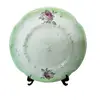 Foto de um(a) Prato Floral São Caetano Anos 40, da categoria de Pratos Decorativos. Prato em porcelana brasileira são caetano, com pintura floral e degradê verde na borda, década de 1940. Diâmetro: 18 cm... Vendido no marketplace Trésors.