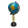 Foto de um(a) Globo Latão e Marfim, da categoria de Globos. Globo terrestre com base latão oxidado e baquelite marfim na haste. Peça única pelo designer marcelus ribas.D: 13cm / A:... Vendido no marketplace Trésors.