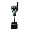 Foto de um(a) Escultura Mão, da categoria de Escultura. Escultura em resina com pátina bronze oxidada, haste em metal e base de madeira ebanizada peça única pelo designer marcelus... Vendido no marketplace Trésors.