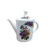 Foto de um(a) Bule Porcelana Steatita com Estampa Floral Policromada, Década de 1970, da categoria de Bules. Bule porcelana steatita com estampa floral policromada, decada de 1970. A: 21,5 cm / L: 13 cm / C do bico até a alça: 23,5... Vendido no marketplace Trésors.