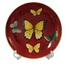 Foto de um(a) Prato Vitrificado Butterfly, Década de 1980, da categoria de Pratos Decorativos. Prato decorativo vitrificado para parede com motivo butterfly fundo ferrugem com arabescos e 4 borboletas. Parte de trás... Vendido no marketplace Trésors.