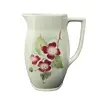 Foto de um(a) Antiga Jarra Art Deco Porcelana Faiança Majólica Alemã, da categoria de Jarros. Antiga jarra em faiança/majólica alemã. Decoração floral típica do período Art Deco. Peça numerada.Medidas 16x13cm. Vendido no marketplace Trésors.