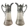 Foto de um(a) Antigo Raro Par De Jarras Claret Jug Cristal Art Nouveau Wmf, da categoria de Garrafas, potes e jarros. WMF. Antigo e raro par de grandes jarras Claret jug em cristal alemão lapidadas à mão, linda decoração floral em relevo.... Vendido no marketplace Trésors.