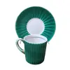 Foto de um(a) Par de Xícaras Gibo Bav anos 50, da categoria de Xícaras. Par de xícaras de cafézinho em porcelana frisada uma amarela e outra verde com filete dourado e resquícios na alça, década... Vendido no marketplace Trésors.