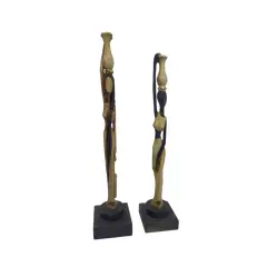 Foto de um(a) Par de esculturas africanas em madeira, da categoria de Escultura. Par de esculturas africanas em madeira, pintada à mão, retratando mulheres carregando baldes. Mede A: 31cm. Vendido no marketplace Trésors.