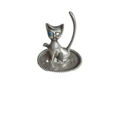 Foto de um(a) Raro porta-anéis anos 70 espessurado a prata, da categoria de Porta-Jóias. Belo e raro porta-anéis espessurado a prata, em formato de gato. Peça vintage dos anos 70. Vendido no marketplace Trésors.
