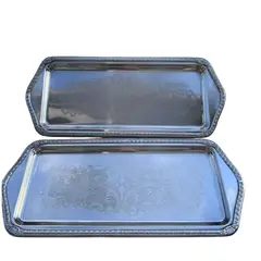 Foto de um(a) Bandeja Retangular em Metal a Prata 90, da categoria de Bandejas. Bandeja a prata medidas 33cm X 14cm - disponível 2 iguais para fazer par *valor do anuncio é unitário*. Vendido no marketplace Trésors.