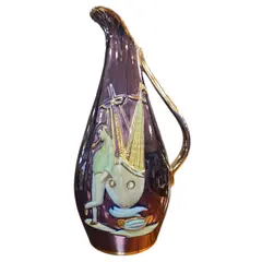 Foto de um(a) Jarra Decorativa Vintage – Cerâmica Metalizada Tema Náutico, da categoria de Garrafas, potes e jarros. Esta peça é um exemplar magnífico do design de interiores das décadas de 50 e 60. Com um formato orgânico e alongado, a... Vendido no marketplace Trésors.