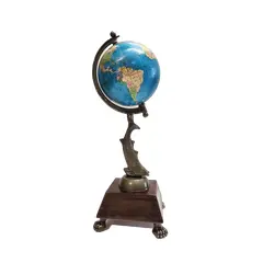 Foto de um(a) Globo Terrestre Robalo e Imbuia, Peça Única, da categoria de Globos. Globo terrestres de mesa: base em imbuia com pés de garra, tendo como haste um robalo em latão com pátina bronze. Globo... Vendido no marketplace Trésors.