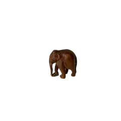 Foto de um(a) Escultura de elefante, da categoria de Modelos e estatuetas. Pequeno elefante esculpido na madeira Mede: 6 x 5 cm. Vendido no marketplace Trésors.