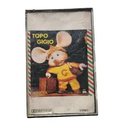 Foto de um(a) Fita K7 Topo Gigio no Brasil | Cassete Infantil Vintage | Disco BAN Estéreo | Anos 80, da categoria de Cassetes. Fita cassete original Topo Gigio no Brasil, lançamento infantil pela gravadora Disco BAN, com participação de Dick Petra e... Vendido no marketplace Trésors.