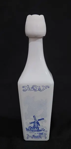 Foto de um(a) Belíssima garrafa opalinada holandesa, da categoria de Garrafas, potes e jarros. Linda garrafa vintage da marca Vandermint, fabricada na Holanda e originária aproximadamente da década de 1970. Ela é... Mostrado de uma perspectiva diferente. Vendido no marketplace Trésors.