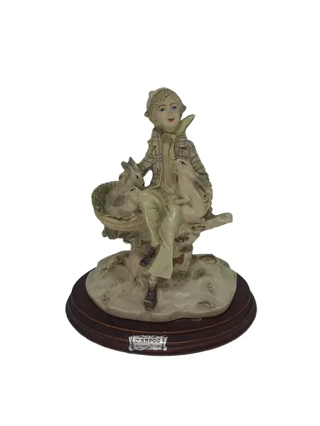 Foto de um(a) Escultura portuguesa de camponês D'Arpos em resina, da categoria de Escultura. Escultura Portuguesa D'Arpos em resina retratando um camponês vestindo paletó xadrez e acompanhado de seus coelhos. MEDE A:... Vendido no marketplace Trésors.