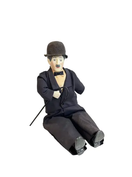 Foto de um(a) ​Boneco Charles Chaplin em porcelana e tecido, da categoria de Bonecos de arte. Boneco do Charles Chaplin em porcelana e tecido, com bengala em metal e chapéu em feltro. Marcas do tempo e uso mas sem nada... Vendido no marketplace Trésors.