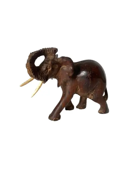 Foto de um(a) Elefante decorativo em madeira, da categoria de Escultura. Elefante decorativo esculpido em madeira. *Contém avaria em uma das orelhas, como mostra a foto. Mede: 17 x 15cm. Vendido no marketplace Trésors.