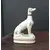Foto de um(a) Escultura Portuguesa - Cachorro, da categoria de Escultura. Elaborada em Porcelana Portuguesa, esta escultura de um Cachorro Galgo exibe uma textura craquelada que lhe confere... Mostrado de uma perspectiva diferente. Vendido no marketplace Trésors.