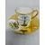 Foto de um(a) Xícara dourada porcelana Bavaria paisagem Genova, da categoria de Xícaras. Xícara avulsa com pires, porcelana Bavaria, em dourado com desenhos retratando a cidade de Genova, como o farol La Lanterna... Mostrado de uma perspectiva diferente. Vendido no marketplace Trésors.