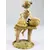 Foto de um(a) Escultura de menina com cesta de peixes, da categoria de Escultura. Escultura de menina com cesta de peixes sentada em um banco, mede 15cm altura. Mínimas marcas de uso. Em bom estado de... Mostrado de uma perspectiva diferente. Vendido no marketplace Trésors.