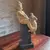 Foto de um(a) Escultura Italiana em terracota menina com cachorro, da categoria de Escultura. Rara e lúdica escultura em terracota ´´ Menino com cachorro`` em coluna de madeira ebonizada.Manufatura Milan... Vendido no marketplace Trésors.