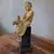 Foto de um(a) Escultura Italiana em terracota menina com cachorro, da categoria de Escultura. Rara e lúdica escultura em terracota ´´ Menino com cachorro`` em coluna de madeira ebonizada.Manufatura Milan... Mostrado de uma perspectiva diferente. Vendido no marketplace Trésors.