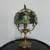 Foto de um(a) Abajur opalina e bronze, da categoria de Abajures. Lindo abajur opalina de bronze pintado de dourado, com cúpula estilo tiffany. Medidas: Altura 38 cm x diâmetro cúpula 20 cm... Mostrado de uma perspectiva diferente. Vendido no marketplace Trésors.