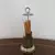 Foto de um(a) Antigo paliteiro em metal, da categoria de Paliteiros. Antigo paliteiro em metal com detalhes em cristal. Medidas : altura 14,5 cm x base 5,5 cm. Mostrado de uma perspectiva diferente. Vendido no marketplace Trésors.