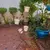 Foto de um(a) Floreira em ferro, da categoria de Móveis para jardim. Antiga floreira de canto em ferro com 5 suportes. Acompanha 4 vasos de porcelana e 1 vaso de cerâmica (perfeito para montar... Mostrado de uma perspectiva diferente. Vendido no marketplace Trésors.