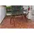 Foto de um(a) Mesa de jantar anos 50-60 com tampo de vidro, da categoria de Mesas de Jantar. Linda mesa de jantar feita na década de 1950/1960. Possui o design modernista, com suas linhas curvas, base em estrutura de... Mostrado de uma perspectiva diferente. Vendido no marketplace Trésors.