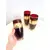 Foto de um(a) ​Trio de copos altos de vidro da década de 50, da categoria de Copos. Trio de copos altos de vidro da década de 50, pintados em bordô, dourado e branco. Marcas do tempo e uso e um com mínimo... Mostrado de uma perspectiva diferente. Vendido no marketplace Trésors.