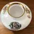 Foto de um(a) Antigo Vasinho Bojudo Opalina Vidro Leitoso Cena Galante, da categoria de Vasos. Delicado e decorativo vasinho bojudo em opalina milk glass (vidro leitoso) com decoração de flores e medalhão central com... Mostrado de uma perspectiva diferente. Vendido no marketplace Trésors.