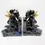 Foto de um(a) Antigo Cerra Livros Escultura De Galo Porcelana Art Deco, da categoria de Apoio para livros. Antigo e grande cerra livros em porcelana artística com figuras de galos, ricamente pintados à mão, e filetes em ouro.... Mostrado de uma perspectiva diferente. Vendido no marketplace Trésors.