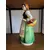 Foto de um(a) Antiga Escultura Feminina Camponesa Porcelana Italiana Lenci, da categoria de Escultura. ~ Made in Italy ~Antiga e grande escultura artística em porcelana italiana. Figura de camponesa com cesta e frutas. A peça é... Mostrado de uma perspectiva diferente. Vendido no marketplace Trésors.