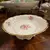 Foto de um(a) Antigo Prato Fruteira Centro De Mesa Porcelana Polonesa Kpm, da categoria de Travessas e tigelas. ~ KPM ~ Receba toda a delicadeza dessa linda peça em porcelana artística polonesa. Ela é uma fruteirinha, ótima para servir... Mostrado de uma perspectiva diferente. Vendido no marketplace Trésors.