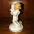 Foto de um(a) Antigo Castiçal Criança Em Porcelana Alemã Von Schierholz, da categoria de Castiçais. Von Schierholz. Antigo e pequeno castiçal, feito e pintado à mão, em porcelana artística alemã. Peça muito delicada e com... Mostrado de uma perspectiva diferente. Vendido no marketplace Trésors.