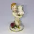 Foto de um(a) Antigo Castiçal Criança Em Porcelana Alemã Von Schierholz, da categoria de Castiçais. Von Schierholz. Antigo e pequeno castiçal, feito e pintado à mão, em porcelana artística alemã. Peça muito delicada e com... Mostrado de uma perspectiva diferente. Vendido no marketplace Trésors.