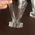 Foto de um(a) Conjunto Cálices Copinhos Em Cristal Francês Saint Louis, da categoria de Copos e taças. 5 antigos copinhos para licor em cristal francês saint louis, selados no fundo, em perfeito estado. Mostrado de uma perspectiva diferente. Vendido no marketplace Trésors.