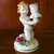 Foto de um(a) Antigo Castiçal Criança Em Porcelana Alemã Von Schierholz, da categoria de Castiçais. Von Schierholz. Antigo e pequeno castiçal, feito e pintado à mão, em porcelana artística alemã. Peça muito delicada e com... Mostrado de uma perspectiva diferente. Vendido no marketplace Trésors.