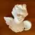 Foto de um(a) Antiga Escultura De Parede Anjo Em Biscuit Francês Branco, da categoria de Objetos de parede esculturais. Antiga escultura anjinho de parede em biscuit francês, peça artística feita e moldada à mão. Medidas 12x13cm. Mostrado de uma perspectiva diferente. Vendido no marketplace Trésors.