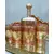 Foto de um(a) Conjunto Indiano Anos 70, da categoria de Jogos de taças e copos. Conjunto indiano e folheado a ouro, 6 copos em vidro (made in korea) e 1 garrafa em cristal âmbar com pintura floral para... Mostrado de uma perspectiva diferente. Vendido no marketplace Trésors.
