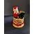 Foto de um(a) Caixinha Porcelana Papai Noel, Década de 2000, da categoria de Cestos e Caixas. Caixa em porcelana policromada com motivo natalino, década de 2000. A: 9,5 cm / Diâmetro: 6 cm peso: 145 g. Mostrado de uma perspectiva diferente. Vendido no marketplace Trésors.