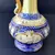 Foto de um(a) Pequena Jarra Blue anos 40, Indústria Brasileira, da categoria de Jarros. Pequena jarra em porcelana com pintura azul cobalto e amarelo perolado, filetada com ouro e grega com trevos também ouro... Mostrado de uma perspectiva diferente. Vendido no marketplace Trésors.