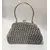 Foto de um(a) Bolsa Crochê Party, Década de 1940, da categoria de Bolsas. Bolsa de festa em crochê com linha prata e fecho de metal com detalhes em baixo relevo e alça também em metal, década de... Mostrado de uma perspectiva diferente. Vendido no marketplace Trésors.