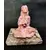 Foto de um(a) Escultura Cristal Woman Anos 90, da categoria de Escultura. Escultura feminina em resina com pátina terracota com um cristal nas mãos, base em granito, década de 1990. A: 15 cm / L:... Mostrado de uma perspectiva diferente. Vendido no marketplace Trésors.